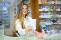 Pharmacist and Client in a Drugstore