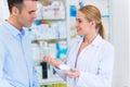 Pharmacist and client at pharmacy Royalty Free Stock Photo