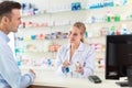 Pharmacist and client at pharmacy Royalty Free Stock Photo