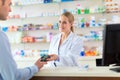 Pharmacist and client at pharmacy Royalty Free Stock Photo