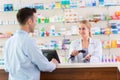 Pharmacist and client at pharmacy Royalty Free Stock Photo