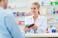 Pharmacist and client at pharmacy Royalty Free Stock Photo