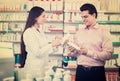 Pharmacist and consulting man in pharmacy Royalty Free Stock Photo