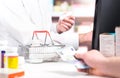 Pharmacist and customer at pharmacy counter. Royalty Free Stock Photo