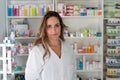 Pharmacist girl looks at the camera with an approving face Royalty Free Stock Photo