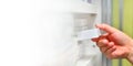 Pharmacist hand holding medicine box in drugstore