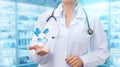 Pharmacist in hand showing pills on the background .