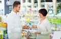 Pharmacist helping customers