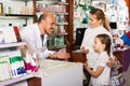 Pharmacist helping customers