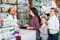 Pharmacist helping customers