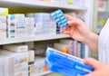 Pharmacist holding medicine box and capsule pack Royalty Free Stock Photo