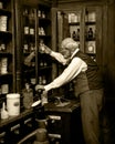 Pharmacist in an old pharmacy Royalty Free Stock Photo