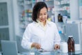 Pharmacist packs medicines in plastic