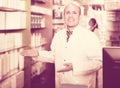 Pharmacist and pharmacy technician posing in modern farmacy Royalty Free Stock Photo