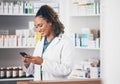 Pharmacist, phone or happy woman texting in pharmacy to contact, email communication or reading chat. Social media, or