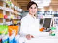 Pharmacist ready to assist in choosing at counter