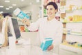 Pharmacist ready to assist in choosing at counter