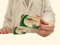 Pharmacist showing a box of Cialis