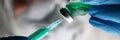 Pharmacist Syringe Dosing Green Liquid Vaccine