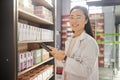 Pharmacist, tablet and portrait of Asian woman in pharmacy, shop or drugstore. Healthcare, medical professional and Royalty Free Stock Photo