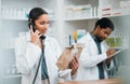 Pharmacist, telephone and medicine package for customer service, healthcare communication and inventory support. Medical