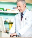 Pharmacist typing at cmoputer Royalty Free Stock Photo