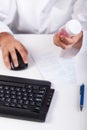 Pharmacist using computer during work Royalty Free Stock Photo