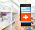 Pharmacist using mobile smart phone in pharmacy Royalty Free Stock Photo