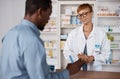 Pharmacist woman, talking to customer about medicine, information or advice on pills box. Black man with pharmacy Royalty Free Stock Photo