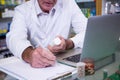 Pharmacist writing prescriptions for medicines Royalty Free Stock Photo