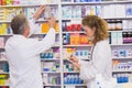 Pharmacists searching medicines with prescription