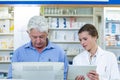 Pharmacists using digital tablet and computer Royalty Free Stock Photo