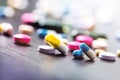 Pharmacy background on a black table. Tablets on a black background. Pills. Medicine and healthy. Close up of capsules. Differend