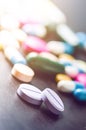 Pharmacy background on a black table. Tablets on a black background. Pills. Medicine and healthy. Close up of capsules. Differend