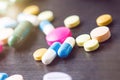 Pharmacy background on a black table. Tablets on a black background. Pills. Medicine and healthy. Close up of capsules. Differend