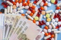 Pharmacy background. Business finance. Russian money and pills on blue backgrouind.