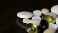 Pharmacy background on a dark table. Levitation pills. Tablets on a dark background which falling down. Pills. Medicine Royalty Free Stock Photo