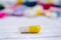 Pharmacy background on a white table. Tablets on a white background. Pills. Medicine and healthy. Close up of capsules. Differend