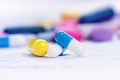 Pharmacy background on a white table. Tablets on a white background. Pills. Medicine and healthy. Close up of capsules. Differend