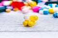 Pharmacy background on a white table. Tablets on a white background. Pills. Medicine and healthy. Close up of capsules. Differend