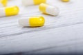 Pharmacy background on a white table. Tablets on a white background. Pills. Medicine and healthy. Close up of capsules. Differend