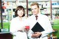 Pharmacy chemist team women and man in drugstore Royalty Free Stock Photo