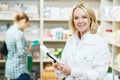 Pharmacy chemist woman in drugstore