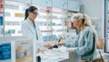 Pharmacy Drugstore Checkout Cashier Counter: Female Pharmacist Service Beautiful Senior Female Royalty Free Stock Photo