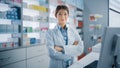 Pharmacy Drugstore: Portrait of Beautiful Asian Female Pharmacist Wearing White Lab Coat, Looks at Royalty Free Stock Photo