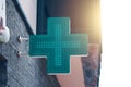 Pharmacy green light cross board. Royalty Free Stock Photo