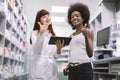 Pharmacy and healthcare concept. Happy smiling Caucasian woman pharmacist with tablet, working at pharmacy, consulting Royalty Free Stock Photo