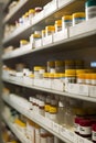 Pharmacy Interior with shelves full of packages with medicine and supplements