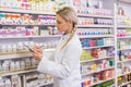 Pharmacy intern writing on clipboard Royalty Free Stock Photo