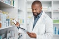Pharmacy, medicine and black man with tablet to check inventory, stock and medication for online prescription